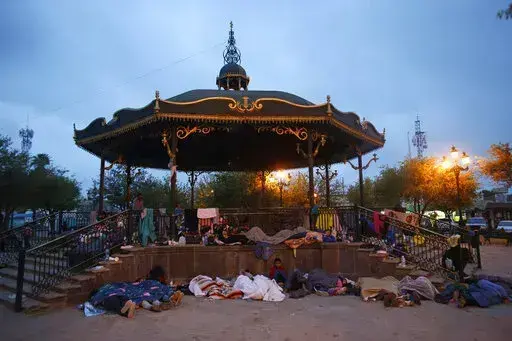 Migrants sleep under a gazebo at a park in Reynosa, Mexico, March 27, 2021. The camp of migrants mainly from Guatemala, El Salvador, Honduras and Haiti sprung up after U.S. officials. citing the pandemic, invoked a a health rule that denies migrants a chance to seek asylum. (AP Photo/Dario Lopez-Mills, File)
