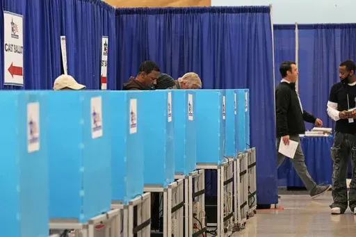 Voters cast ballots at the Chicago Early Voting Loop Supersite in Chicago, Oct. 24, 2024. (AP Photo/Nam Y. Huh)