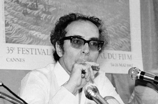 Film director Jean-Luc Godard smokes at Cannes festival, France on May 25, 1982. Director Jean-Luc Godard, an icon of French New Wave film who revolutionized popular 1960s cinema, has died, according to French media. He was 91. Born into a wealthy French-Swiss family on Dec. 3, 1930, in Paris, the ingenious "enfant terrible" stood for years as one of the world's most vital and provocative directors in Europe and beyond — beginning in 1960 with his debut feature "Breathless." (AP Photo/Jean-Jac