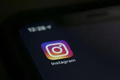 The Instagram app is displayed on a computer on Friday, Aug. 23, 2019, in New York.  Instagram is blocking posts that mention abortion from public view, Tuesday, June 28, 2022, in some cases requiring its users to confirm their age before letting them view posts that offer up information about the procedure.  (AP Photo/Jenny Kane, File)