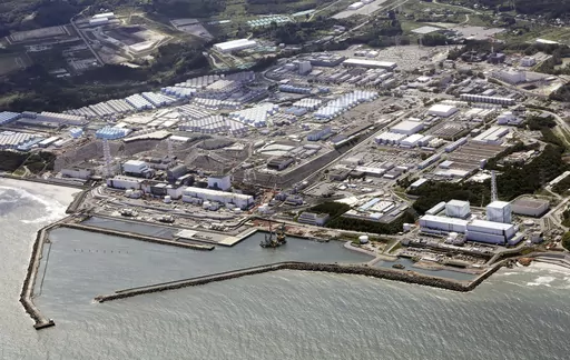 This aerial view shows the wrecked Fukushima Daiichi nuclear power plant in Okuma town, northeastern Japan, on Aug. 24, 2023. A drone small enough to fit in one's hand flew inside one of the damaged reactors at the wrecked nuclear power plant Wednesday, Feb. 28, 2024, in hopes it can examine some of the molten fuel debris in areas where earlier robots failed to reach. (Kyodo News via AP, File)