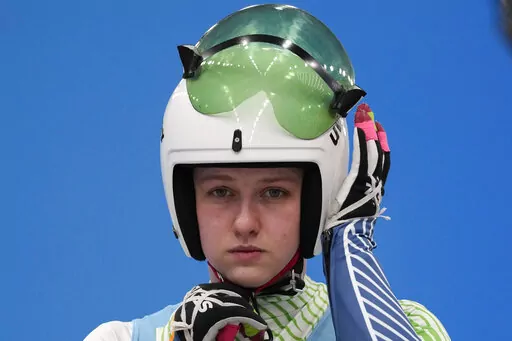Elsa Desmond, of Ireland, prepares to start for the luge women's singles run 1 at the 2022 Winter Olympics, Monday, Feb. 7, 2022, in the Yanqing district of Beijing.(AP Photo/Mark Schiefelbein)