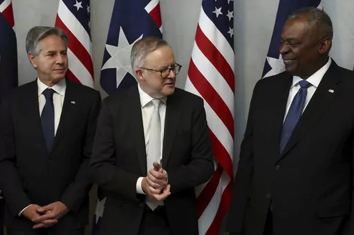 Australian Prime Minister Anthony Albanese, center, speaks with U.S. Secretary of State Antony Blinken, left, and U.S. Defense Secretary Lloyd Austin prior to a lunch in Brisbane, Australia Friday, July 28, 2023. (Pat Hoelscher/Pool Photo via AP)