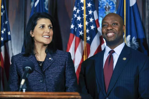 South Carolina Gov. Nikki Haley, left, announces Rep. Tim Scott, right, as Sen. Jim DeMint's replacement in the U.S. Senate during a news conference at the South Carolina Statehouse, Dec. 17, 2012, in Columbia, S.C. Scott has filed paperwork to enter the 2024 Republican presidential race. He'll be testing whether a more optimistic vision of America’s future can resonate with GOP voters who have elevated partisan brawlers in recent years. (AP Photo/Rainier Ehrhardt, File)
