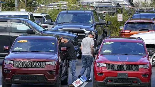 Shoppers examine used Jeep Grand Cherokees at a dealership in Pittsburgh on Sept. 29, 2022. The stress and expense of buying a used vehicle can be greatly reduced if you avoid common mistakes. (AP Photo/Gene J. Puskar)