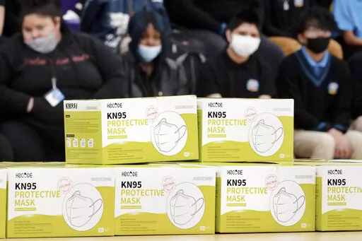 Boxes of KN95 protective masks are stacked together before being distributed to students at Camden High School in Camden, N.J., Wednesday, Feb. 9, 2022. According to a study by the Centers for Disease Control and Prevention released Tuesday, April 26, 2022,  three out of every four U.S. children have been infected with COVID-19. (AP Photo/Matt Rourke, File)
