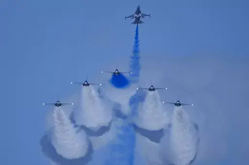 South Korean Air Force's Black Eagles aerobatic team performs during the first day of the Singapore Airshow in Singapore, Tuesday, Feb. 20, 2024. (AP Photo/Vincent Thian)