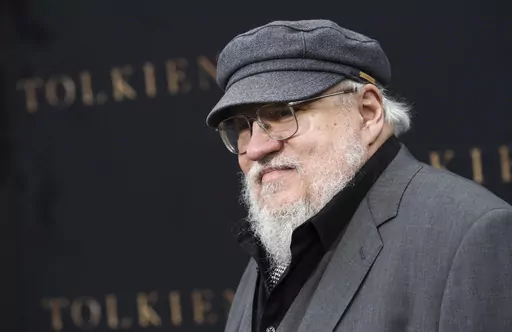 Author George R.R. Martin poses at the premiere of the film "Tolkien," at the Regency Village Theatre on May 8, 2019, in Los Angeles. Warner Bros. Discovery is sticking with safe bet franchises that will likely lure viewers, including a “Harry Potter” series and a “Game of Thrones” prequel for its rebranded Max streaming service, the company announced Wednesday, April 12, 2023. (Photo by Chris Pizzello/Invision/AP, File)