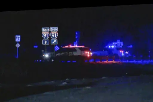 This image taken from video provided by WCAX shows police cars closing off a road after a shooting involving a U.S. Border Patrol agent on Interstate 91 near Coventry, Vt., on Jan. 20, 2025. (WCAX via AP, File)
