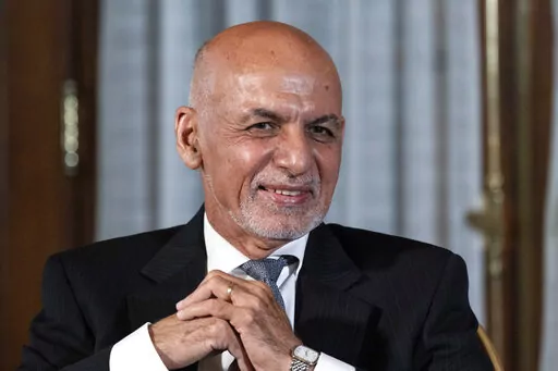 FILE - Afghan President Ashraf Ghani is seated after his meeting with U.S. President Joe Biden in Washington, June 25, 2021. In an interview aired by the BBC on Thursday, Dec. 30, 2021, Afghanistan's former president recounts his final hours in office, says he had just minutes to decide to flee and denies an agreement was in the works for a peaceful takeover, disputing accounts of former government officials, Taliban and even a former U.S. negotiator. (AP Photo/Alex Brandon, File)