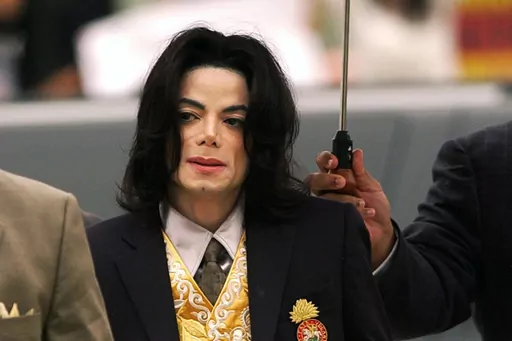 Michael Jackson arrives at the Santa Barbara County Courthouse for his child molestation trial in Santa Maria, Calif., on May 25, 2005. A California appeals court on Wednesday, July 26, 2023, will consider reviving the dismissed lawsuits of two men who allege Michael Jackson sexually abused them as children for years, a move the court appears likely to make after a tentative decision that would order the cases back to a lower court for trial. (Aaron Lambert/Santa Maria Times via AP, Pool)