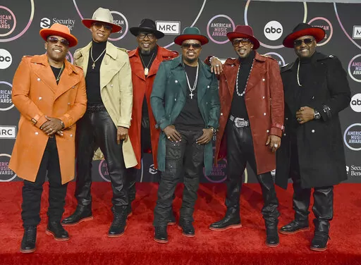 Michael Bivins, from left, Ronnie Devoe, Bobby Brown, Ricky Bell, Ralph Tresvant and Johnny Gill of New Edition appear in the press room at the American Music Awards in Los Angeles on Nov. 21, 2021. The group will perform on ABC's “New Year’s Rockin’ Eve.” (Photo by Jordan Strauss/Invision/AP, File)