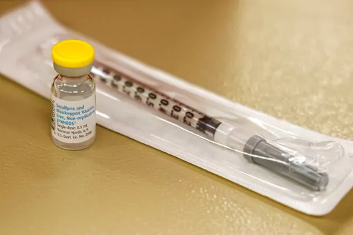 A vial containing the monkeypox vaccine and a syringe is set on the table at a vaccination clinic run by the Mecklenburg County Public Health Department in Charlotte, N.C., Saturday, Aug. 20, 2022. In the wake of a study released on Thursday, Sept. 8, 2022, U.S. officials are considering broadening recommendations for who gets vaccinated against monkeypox, possibly to include many men being treated for HIV or those who recently had other sexually transmitted infections. (AP Photo/Nell Redmond, F