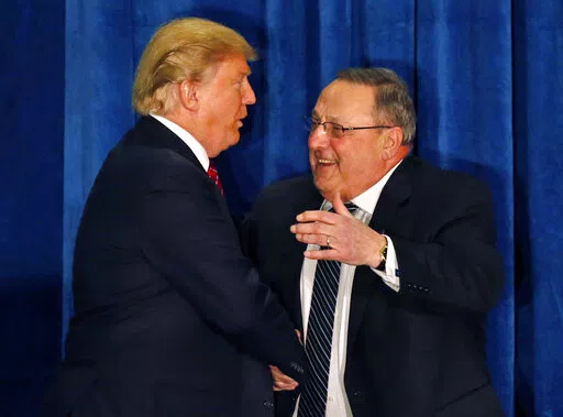 Republican presidential candidate Donald Trump is welcomed to the stage by Maine Gov. Paul LePage at campaign stop in Portland, Maine, in this March 3, 2016 file photo. LePage, who moved to Florida after his second term, has returned to Maine to challenge Democratic Gov. Janet Mills. (AP Photo/Robert F. Bukaty)