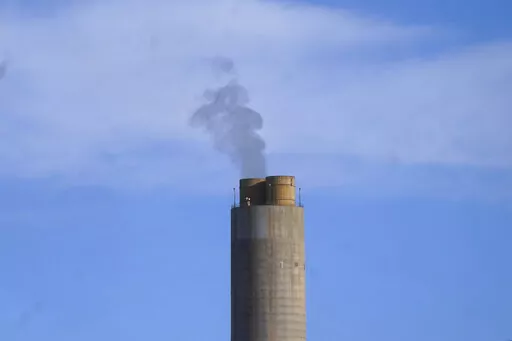 A smokestack stands at a coal plant on June 22, 2022, in Delta, Utah. NASA on Tuesday, Nov. 29, announced that its GeoCarb mission, which was supposed to be a low-cost satellite to monitor carbon dioxide, methane and how plant life changes over North and South America, was being killed because of cost overruns. (AP Photo/Rick Bowmer, File)