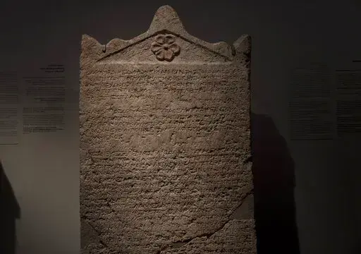 The Heliodorus Stele, loaned by American billionaire Michael Steinhardt, is displayed at the Israel Museum in Jerusalem, Wednesday, Jan. 5, 2022. Last month, Steinhardt surrendered the artifact, along with 179 others valued at roughly $70 million, as part of a landmark deal with the Manhattan District Attorney's office to avoid prosecution. Eight Neolithic masks loaned by Steinhardt to the Israel Museum for a major exhibition in 2014 were also seized as part of the billionaire's deal with New Yo