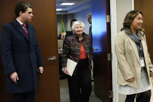 U.S. Treasury Secretary Janet Yellen tours the work area during a visit to the Financial Crimes Enforcement Network (FinCEN) in Vienna, Va., Monday, Jan. 8, 2024. Yellen announced that 100,000 businesses have joined a new database that collects "beneficial ownership" information on firms as part of a new government effort to unmask shell company owners. (AP Photo/Susan Walsh)