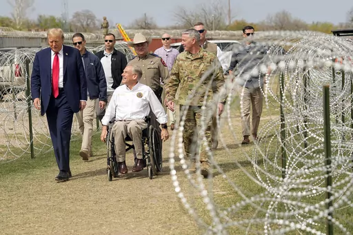 Republican presidential candidate former President Donald Trump talks with Texas Gov. Greg Abbott during a visit to the U.S.-Mexico border, Feb. 29, 2024, in Eagle Pass, Texas. As Trump campaigns on the promises of mass deportations and pardons for those convicted in the Jan. 6 Capitol attack, his ideas are being met with little pushback by a new era of Republicans in Congress. It's a shift from the first time around when Trump encountered early skepticism and, once in a while, the uproar of con