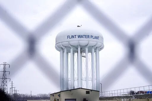 The Flint water plant tower is seen on Jan. 6, 2022, in Flint, Mich.  A Michigan judge dismissed charges Tuesday, Oct. 4, 2022,  against seven people in the Flint water scandal, including two former state health officials blamed for deaths from Legionnaires' disease. Judge Elizabeth Kelly took action three months after the Michigan Supreme Court said a one-judge grand jury had no authority to issue indictments. (AP Photo/Carlos Osorio, File)