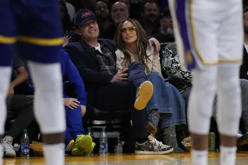Ben Affleck and Jennifer Lopez watch an NBA basketball game between the Golden State Warriors and the Los Angeles Lakers in Los Angeles, March 16, 2024. (AP Photo/Ashley Landis, File)