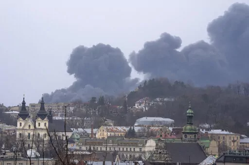 Smoke rises in the air in Lviv, western Ukraine, Saturday, March 26, 2022. With Russia continuing to strike and encircle urban populations, from Chernihiv and Kharkiv in the north to Mariupol in the south, Ukrainian authorities said Saturday that they cannot trust statements from the Russian military Friday suggesting that the Kremlin planned to concentrate its remaining strength on wresting the entirety of Ukraine's eastern Donbas region from Ukrainian control. (AP Photo/Nariman El-Mofty)