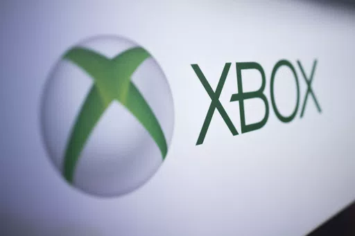 The Xbox logo is pictured at the Paris Games Week in Paris, Nov. 3, 2017. Several exclusive Xbox games will be soon making their way to rival consoles, the video gaming brand and its parent company Microsoft announced Thursday, Feb. 15, 2024. (AP Photo/Kamil Zihnioglu, File)