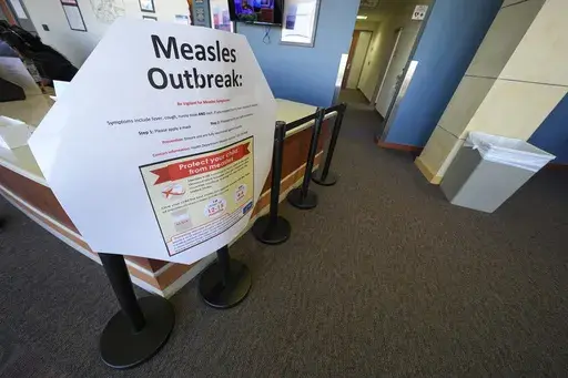 A measles sign is seen at the Texas Tech University Health Sciences Center, Feb. 25, 2025, in Lubbock, Texas. (AP Photo/Julio Cortez, file)