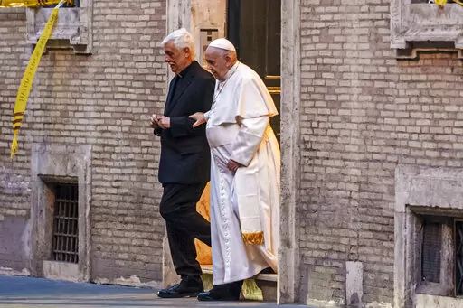 Pope Francis is flanked by Jesuits' superior general Arturo Sosa Abascal, left as he leaves the Church of the Gesu', mother church of the Society of Jesus (Jesuits), after presiding a mass on March 12, 2022. The head of Pope Francis’ Jesuit religious order admitted Wednesday, Dec. 14, 2022, that a famous Jesuit priest had been convicted of one of the most serious crimes in the Catholic Church some two years before the Vatican decided to shelve another case against him for allegedly abusing oth