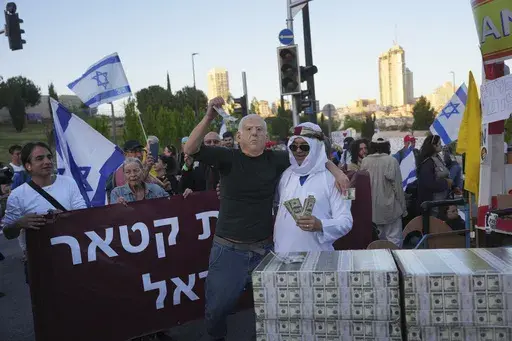 People protest against Prime Minister Benjamin Netanyahu's government as they block a highway in Jerusalem, Monday, March 31, 2025. (AP Photo/Ohad Zwigenberg)