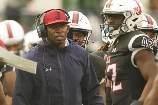 Jackson State head coach Deion Sanders glares at his players as they exit the field during the second half of an NCAA college football game against Southern University in Jackson, Miss., Saturday, Oct. 29, 2022. Jackson State won 35-0. (AP Photo/Rogelio V. Solis)