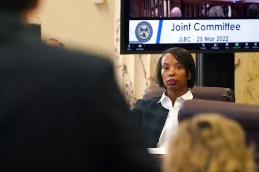 Rep. Angela Cockerham, I-Magnolia, listens as Mississippi's revenue estimate is discussed during a meeting of the Joint Legislative Budget Committee, Friday, March 25, 2022, at the Capitol in Jackson, Miss. (AP Photo/Rogelio V. Solis)