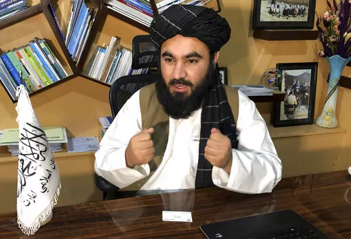 Education Ministry spokesman Mawlvi Aziz Ahmad Rayan speaks during an interview with The Associated Press in Kabul, Afghanistan, Wednesday, March 23, 2022. Afghanistan's Taliban rulers unexpectedly decided against reopening schools Wednesday to girls above the sixth grade, reneging on a promise and opting to appease their hard-line base at the expense of further alienating the international community. (AP Photo/Mohammed Shoaib Amin)