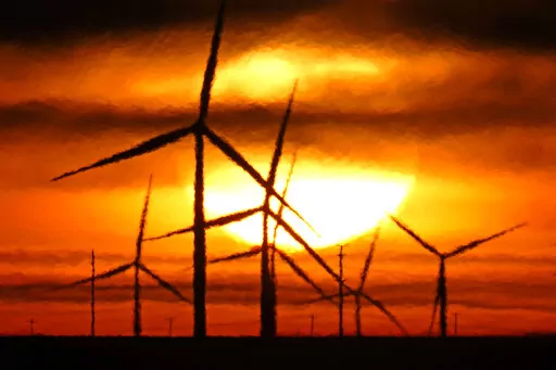 Wind turbines are silhouetted against the rising sun Wednesday, Jan. 13, 2021, near Spearville, Kan.  A new study released on Wednesday, April 13, 2022, finds that if the nations of the world live up to their promises, future climate climate change can be limited to the weaker of two international goals. According to a study, the world is potentially on track to keep global warming at or a shade below 2 degrees Celsius (3.6 degrees Fahrenheit) hotter than pre-industrial times, a goal that once s