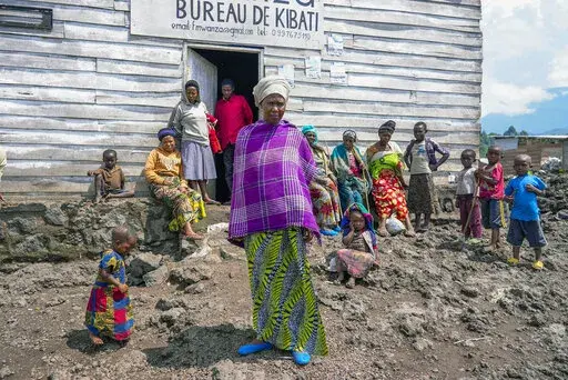 Pasika Bagerimana stands outside a temporary shelter she shares with others who fled fighting, in Nyiragongo, Democratic Republic of Congo, Aug. 31, 2022. Bagerimana, who lost two children to hunger, worries her remaining two children might be next. "Hunger is killing people," she says. Hunger is soaring across parts of Congo's war-torn North Kivu province where the fighting between M23 rebels and government soldiers has been raging since March, according to aid workers, civilians and health wor