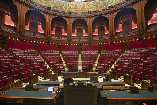 A view of the hemicycle inside Italy's Lower Chamber Montecitorio Palace, in Rome, Wednesday, Sept. 16, 2020. Forming a new government in Italy involves time and decades-old rituals, so although far-right leader Giorgia Meloni emerged as the clear winner in elections last month, the process of getting a new ruling coalition up and running will take time, maybe weeks. (AP Photo/Andrew Medichini, File)