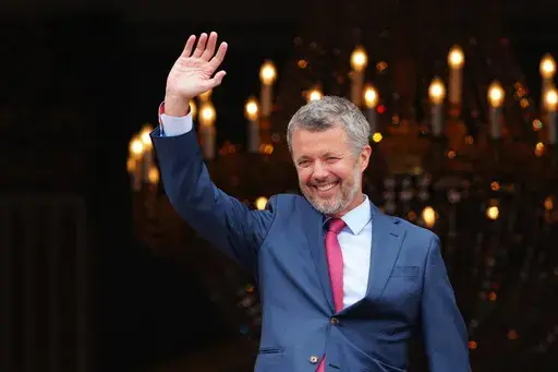 Denmark's King Frederik X, celebrating his 56th birthday, waves from the balcony of Frederik VIII's Palace, Amalienborg Castle in Copenhagen, Sunday, May 26, 2024. (Ida Marie Odgaard/Ritzau Scanpix via AP, File)