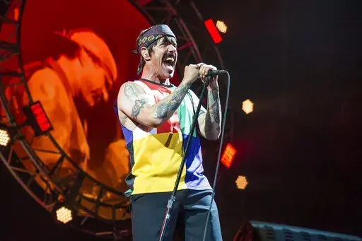 Anthony Kiedis of the Red Hot Chili Peppers performs at the Bonnaroo Music and Arts Festival on Saturday, June 10, 2017, in Manchester, Tenn. Organizers of this year's New Orleans Jazz Fest say the band Red Hot Chili Peppers has been added to the lineup of the 2022 event. The festival said Friday, April 8, 2022, that the appearance is set for Sunday, May 1, and will be the group's first performance at Jazz Fest since 2016. (Photo by Amy Harris/Invision/AP, File)
