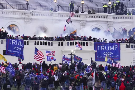 Rioters at the U.S. Capitol on Jan. 6, 2021, in Washington. Daniel “D.J.” Rodriguez, a California man who drove a stun gun into a police officer's neck during one of the most violent clashes of the U.S. Capitol riot was sentenced on Wednesday to more than 12 years in prison. Rodriguez yelled, “Trump won!” as he was led out of the courtroom where U.S. District Judge Amy Berman Jackson sentenced him to 12 years and seven months behind bars for his role in the Jan. 6, 2021, attack. (AP Phot