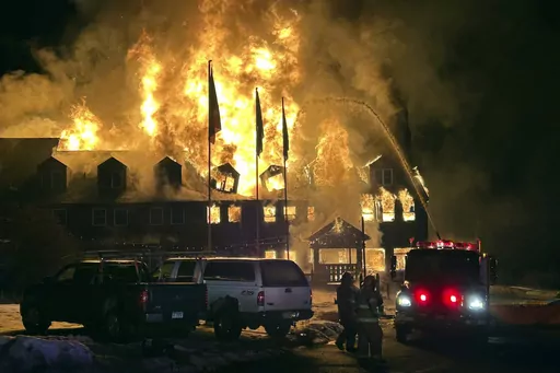 Firefighters battle an overnight blaze that destroyed the Lutsen Lodge on the North Shore of Lake Superior, early Tuesday, Feb. 6, 2024, in Lutsen, Minn. (Edward Vanegas via AP)