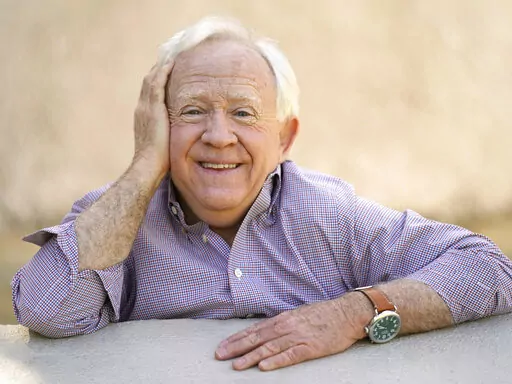 Leslie Jordan poses for a portrait at Pan Pacific Park in the Fairfax district of Los Angeles on Thursday, April 8, 2021 to promote his new book "How Y'all Doing?: Misadventures and Mischief from a Life Well Lived." Jordan, the Emmy-winning actor whose wry Southern drawl and versatility made him a comedy and drama standout on TV series including “Will & Grace” and “American Horror Story,” has died. He was 67. (AP Photo/Damian Dovarganes, File)