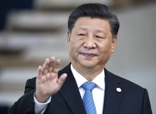 China's President Xi Jinping greets the media prior to a meeting of leaders of the BRICS emerging economies at the Itamaraty palace in Brasilia, Brazil, on Nov. 14, 2019. Xi is expected to meet his Russian counterpart Vladimir Putin during a visit to the neighboring Central Asian nations of Uzbekistan and Kazakhstan later in September 2022, in what would be his first overseas visits since the start of the COVID-19 outbreak in late 2019. (AP Photo/Pavel Golovkin, Pool, File)