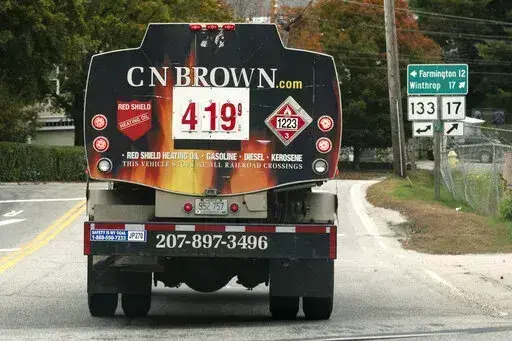 A fuel delivery truck advertises its price for a gallon of heating oil, Oct. 5, 2022 in Livermore Falls, Maine. The Labor Department releases the Producer Price Index for October on Tuesday. (AP Photo/Robert F. Bukaty, File)