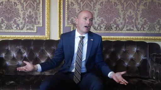 Utah Gov. Spencer Cox speaks during an interview at the Utah State Capitol, Friday, March 4, 2022, in Salt Lake City. Cox vetoed a ban on transgender students playing girls’ sports on Tuesday, March 22, 2022, becoming the second Republican governor to overrule state lawmakers who have taken on youth sports in a broader culture war over how Americans view gender and sexuality. (AP Photo/Rick Bowmer ,File)