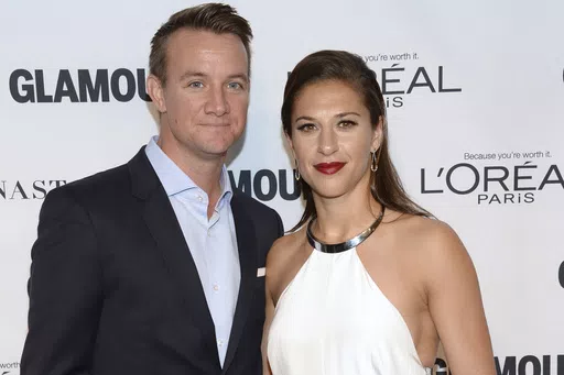 Brian Hollins, left, and Carli Lloyd attend the 25th annual Glamour Women of the Year Awards at Carnegie Hall on Monday, Nov. 9, 2015, in New York. Retired U.S. women's soccer star Carli Lloyd and her husband are expecting their first child in October. The 41-year-old Lloyd announced her pregnancy on Instagram on Wednesday, May 1, 2024. She has been married to Brian Hollins for seven years (Photo by Evan Agostini/Invision/AP, File)