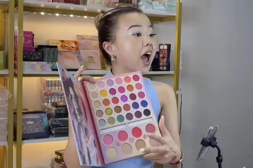 In this photo released by Yan Guanghua Yan Guanghua, one of TikTok earliest livestreamers in China, conducts a livestream from her studio in Shenzhen in southern China's Guangdong province in July 2023. Chinese livestreamers have set their sights on TikTok shoppers in the U.S. and Europe, hawking everything from bags and apparel to crystals with eyes on a potentially lucrative market, despite uncertainties over the Chinese social media platform's future in the U.S. and elsewhere. (Yan Guanghua v