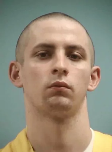 This image provided by the Mississippi Department of Corrections shows Axel Cox, 24, of Gulfport, Miss. Cox, who burned a cross in his front yard to intimidate his Black neighbors in December 2020, was sentenced Thursday, March 9, 2023, to 42 years in prison. (Mississippi Department of Corrections via AP, File)