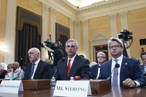 Rusty Bowers, Arizona state House Speaker, from left, Brad Raffensperger, Georgia Secretary of State, and Gabe Sterling, COO for the Georgia Secretary of State’s Office, attend a hearing investigating the Jan. 6 attack on the U.S. Capitol at the Capitol in Washington, June 21, 2022. With six months to go before the presidential election, concerns are running high among election officials that public distrust of voting and ballot counting persists. Sterling is part of an effort that seeks to br