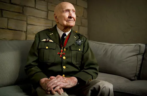 Gail Halvorsen, also know as the "Candy Bomber", poses for a portrait at his son's home in Midway, Utah, on Oct. 7, 2020. The man known as the "Candy Bomber" for his airdrops of sweets during the Berlin Airlift when World War II ended nearly 75 years ago has died. Gail Halvorsen was 101 when he died Wednesday, Feb. 16, 2022, in his home state of Utah surrounded by most of his children after a brief illness, James Stewart, the director of the Gail Halvorsen Aviation Education Foundation, said Thu