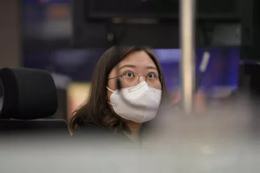 A currency trader watches computer monitors at a foreign exchange dealing room in Seoul, South Korea, Thursday, April 28, 2022. (AP Photo/Lee Jin-man)