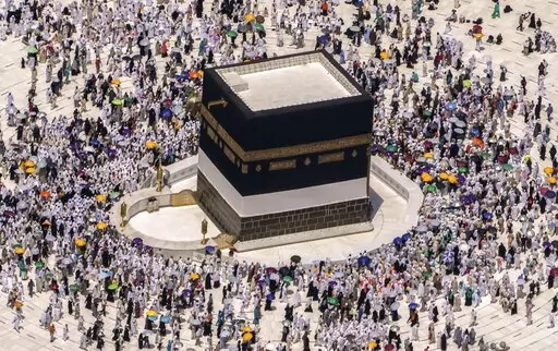 Muslim pilgrims walk around the Kaaba, the cubic building at the Grand Mosque, during the annual hajj pilgrimage, in Mecca, Saudi Arabia, on July 10, 2022. Islam's annual hajj pilgrimage in Saudi Arabia will return to pre-pandemic levels in 2023 after restrictions saw the annual religious commemoration curtailed over concerns about the coronavirus, authorities say. (AP Photo/Amr Nabil, File)
